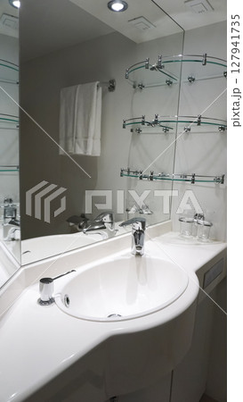 Bathroom with shower cabin, toilet on a cruise ship Bathroom with shower cabin, toilet on a cruise ship 127941735
