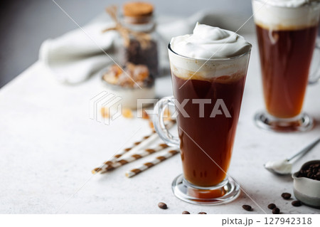 Iced coffee in a tall glass Iced coffee in a tall glass 127942318