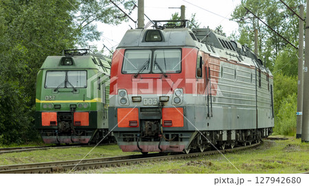 Two electric trains standing on the railway tracks in the depot 127942680