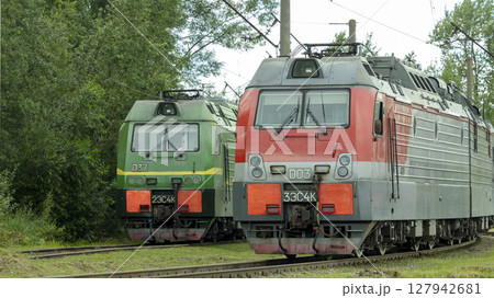 Two electric trains standing on the railway tracks in the depot 127942681