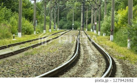 electric train tracks on a bright Sunny day 127942692