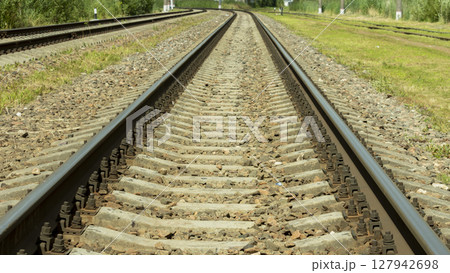 electric train tracks on a bright Sunny day 127942698