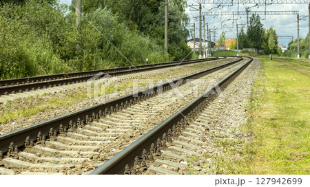 electric train tracks on a bright Sunny day 127942699