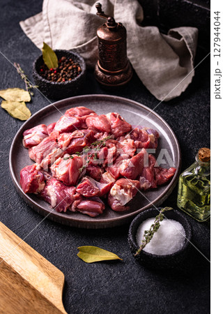 Raw chopped meat with spices Raw chopped meat with spices 127944044