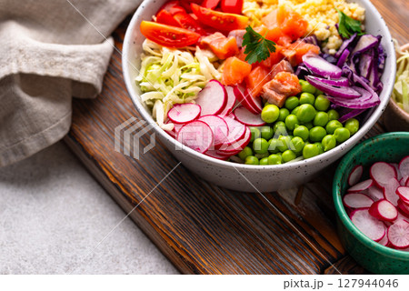 Balanced healthy bowl with vegetables and salmon Balanced healthy bowl with vegetables and salmon 127944046