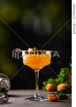 Fresh apricot Bellini cocktail with mint Fresh apricot Bellini cocktail with mint 127944062
