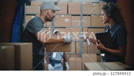 Logistics Distribution Warehouse: Diverse Employees Unloading Delivery Truck with Cardboard Boxes Logistics Distribution Warehouse: Diverse Employees Unloading Delivery Truck with Cardboard Boxes 127949413