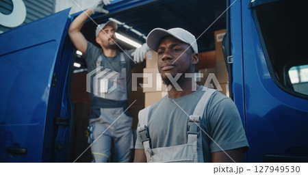 Portrait of Multiethnic Workers Standing Outside of Logistics Retail Warehouse, Looking at Camera 127949530