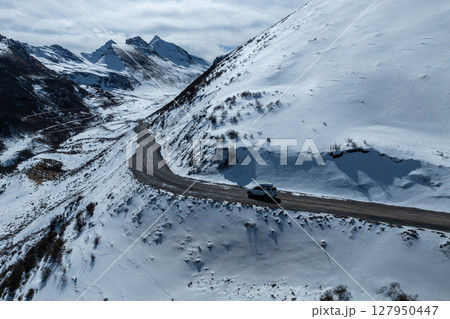 Driving off road car in high altitude mountains in tibet, China 127950447