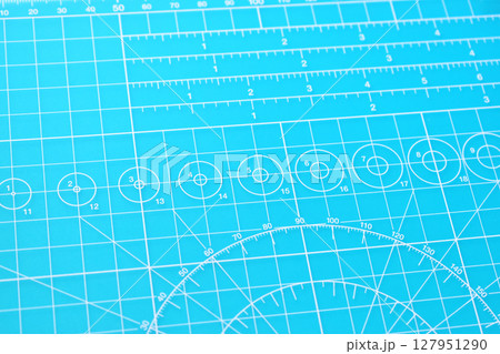 blue cutting mat board background with line and scale measure guide pattern for object art design 127951290