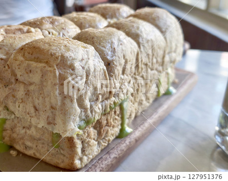 Roti Sarikaya or Indonesian pull apart bread with a vibrant green kaya or coconut jam filling, popular in Southeast Asia. 127951376