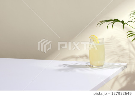 Minimal Aesthetic Beverages in Natural Light with Greenery. 127952649