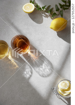 Minimal Aesthetic Beverages in Natural Light with Greenery. 127952657