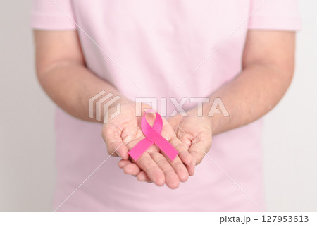 Elderly woman with pink Ribbon for Pink October Breast Cancer Awareness month, May Women Health, August World Breastfeeding week, Nursing Mothers, Pregnancy and Infant Loss Remembrance, Stillbirth Elderly woman with pink Ribbon for Pink October Breast Cancer Awareness month, May Women Health, August World Breastfeeding week, Nursing Mothers, Pregnancy and Infant Loss Remembrance, Stillbirth 127953613