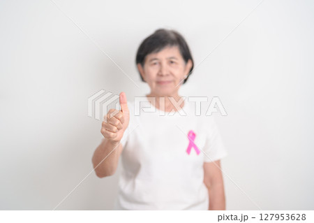 Elderly woman with pink Ribbon for Pink October Breast Cancer Awareness month, May Women Health, August World Breastfeeding week, Nursing Mothers, Pregnancy and Infant Loss Remembrance, Stillbirth Elderly woman with pink Ribbon for Pink October Breast Cancer Awareness month, May Women Health, August World Breastfeeding week, Nursing Mothers, Pregnancy and Infant Loss Remembrance, Stillbirth 127953628