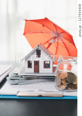 Concept business house finance protection office plan investment buy sell home ensuring idea financial security. residence agent hand protect purchase insurance and secure favorable loan deal. Concept business house finance protection office plan investment buy sell home ensuring idea financial security. residence agent hand protect purchase insurance and secure favorable loan deal. 127954409