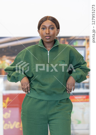 A Stylish and Fashionable Woman Wearing a Chic Green Athleisure Outfit that Exudes Confidence A Stylish and Fashionable Woman Wearing a Chic Green Athleisure Outfit that Exudes Confidence 127955273