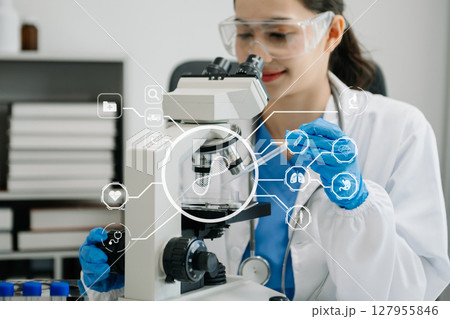 DNA molecule testing concepts. The doctor in a mask examines DNA molecules on the chemical laboratory with virtual icon 127955846