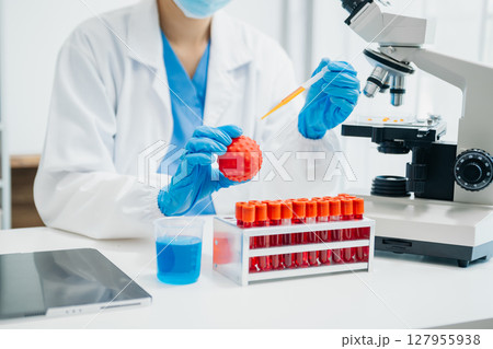 Coronavirus COVID 19 medical test vaccine research and development concept. Scientist in laboratory study and analyze scientific sample of Coronavirus antibody Coronavirus COVID 19 medical test vaccine research and development concept. Scientist in laboratory study and analyze scientific sample of Coronavirus antibody 127955938