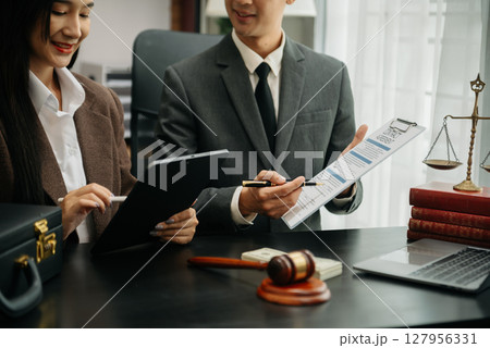 Business and Male lawyer or judge consult having team meeting with client, Law and Legal services concept.Customer service good cooperation in office Business and Male lawyer or judge consult having team meeting with client, Law and Legal services concept.Customer service good cooperation in office 127956331