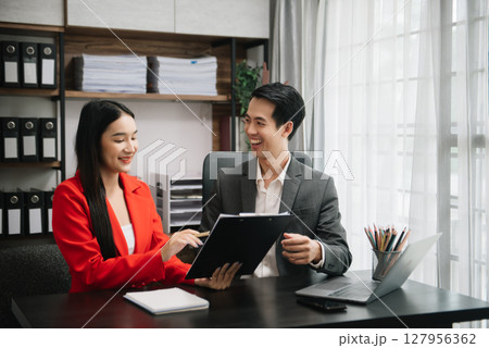 Team work process. Photo young business crew working with new startup project. Project managers meeting. Analyze plans, papers. At office 127956362