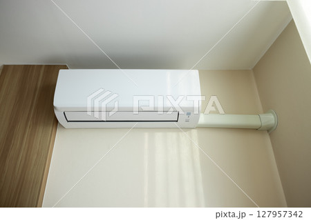 Air conditioner in room for cool climate. Air conditioner in room for cool climate. 127957342