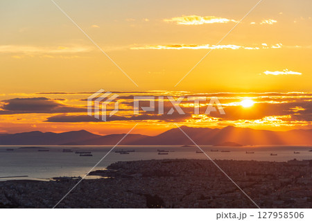A breathtaking view of the sunset over the city of Athens, Greece from the top of the Lycabettus hill 127958506