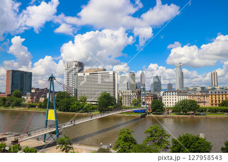 Frankfurt am Main skyline with skyscrapers and bridge over the Main river, Germany Frankfurt am Main skyline with skyscrapers and bridge over the Main river, Germany 127958543