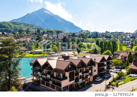 View of the Lake Thun and Niesen mountain (so called Swiss Pyramid) in Spiez, Switzerland View of the Lake Thun and Niesen mountain (so called Swiss Pyramid) in Spiez, Switzerland 127959124