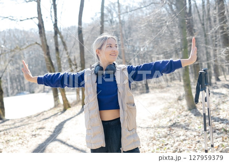 Young woman practicing mindfulness in the forest during trekking day 127959379