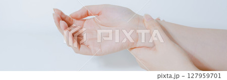 massage hand and finger after pain and ache in office working with white isolated background massage hand and finger after pain and ache in office working with white isolated background 127959701