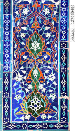 Vertical background with detail of ancient mosaic walls with floral and geometric ornament. Traditional tile decoration on wall, Samarkand, Uzbekistan 127960496