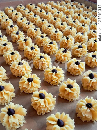 Colorful and buttery spritz cookies, crafted in various festive shapes. Crisp, light, and melt-in-your-mouth delicious, these treats are perfect for holidays or any joyful occasion. Colorful and buttery spritz cookies, crafted in various festive shapes. Crisp, light, and melt-in-your-mouth delicious, these treats are perfect for holidays or any joyful occasion. 127961331