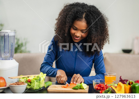 Fit woman enjoys healthy fruit breakfast after yoga training. fitness, nutrition, home lifestyle. Fit woman enjoys healthy fruit breakfast after yoga training. fitness, nutrition, home lifestyle. 127963613