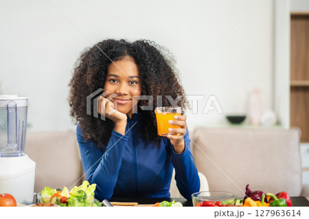 Fit woman enjoys healthy fruit breakfast after yoga training. fitness, nutrition, home lifestyle. Fit woman enjoys healthy fruit breakfast after yoga training. fitness, nutrition, home lifestyle. 127963614