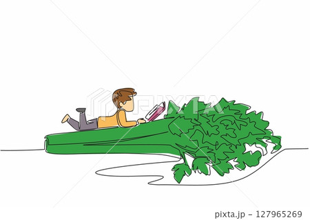 Continuous one line drawing boy reading on celery. Reading while lying on the stomach. Meaningful relaxation. Boy Reading Book at Vegetables and Fruits. Single line draw design vector illustration 127965269