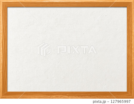 木製フレームのオレンジ色の木枠のある白い綿麻キャンバス地ボードの背景画像 127965997
