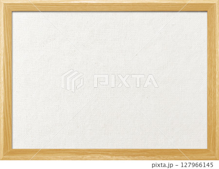 木製フレームの淡いオレンジ色の木枠のある白い綿麻キャンバス地ボードの背景画像 127966145