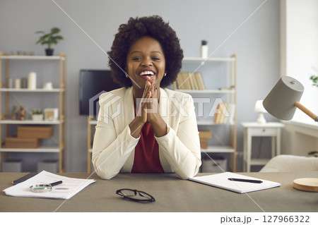 African american business woman talking and giving online advice to her client using laptop webcam. 127966322