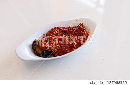 Aubergine appetizer, eggplant saksuka salad 127968356