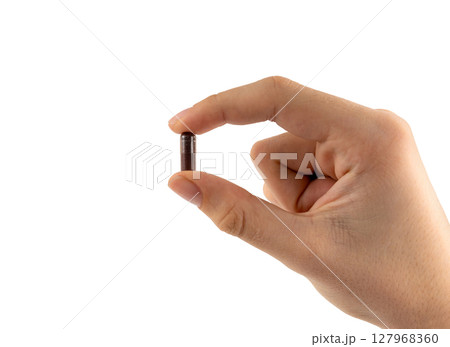 Iron capsule isolated, Fe pills, brown hemoglobin supplement tablets, vitamin capsules on white 127968360