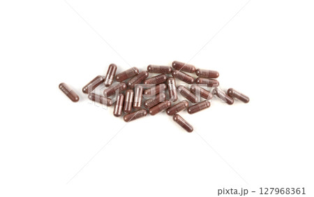 Iron capsule isolated, Fe pills, brown hemoglobin supplement tablets, vitamin capsules on white 127968361