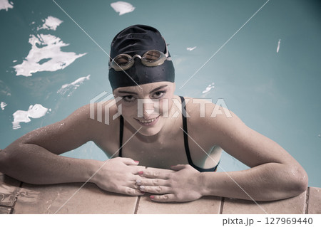 Woman athlete in swimming pool water. Sport. 127969440