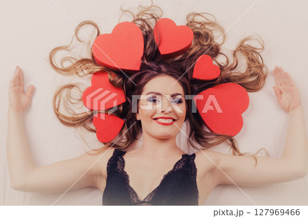 Woman in lingerie in bed. Valentines day love. Woman in lingerie in bed. Valentines day love. 127969466