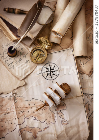 Vintage old maps and objects traveler-explorer 127970437