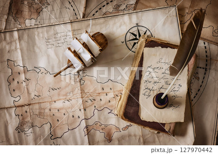 Vintage old maps and objects traveler-explorer 127970442