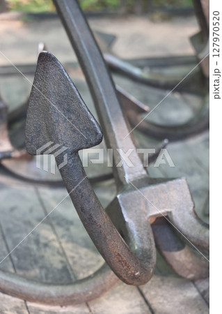 Old historical ship anchor. old rusty anchor. Old historical ship anchor. old rusty anchor. 127970520