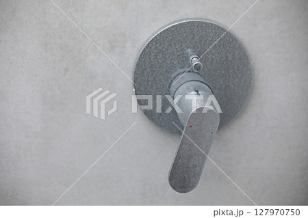 Dirty calcified shower mixer tap, faucet with limescale on it, plaque from water, Chrome-plated shower, close up photo Dirty calcified shower mixer tap, faucet with limescale on it, plaque from water, Chrome-plated shower, close up photo 127970750