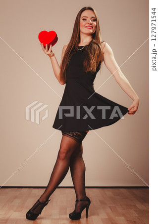 Sexy woman dancing with heart 127971544