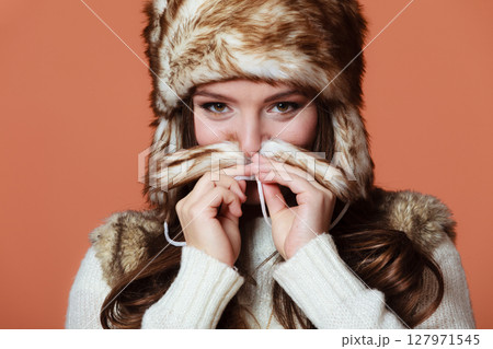 Girl in fur cap Girl in fur cap 127971545